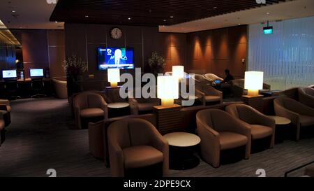 SINGAPORE, SINGAPORE - 14 APRIL 2015: Interior of premium lounge at an international airport with comfortable seating Stock Photo