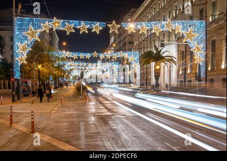 Light trail on avenue decorated with Christmas lights Stock Photo