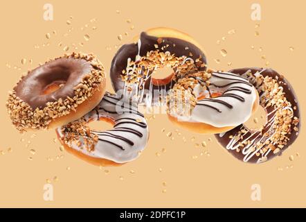 Sweet flying donuts on color background Stock Photo