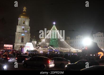 Kiev, Ukraine. 19th Dec, 2020. The main Christmas tree of Ukraine lits during the lighting ceremony at the St. Sophia Square in Kiev, Ukraine, 19 December 2020. The main Christmas tree of Ukraine 31 meters high is artificial and decorated with 1500 toys and about 10 km of colorful garlands. Credit: Serg Glovny/ZUMA Wire/Alamy Live News Stock Photo