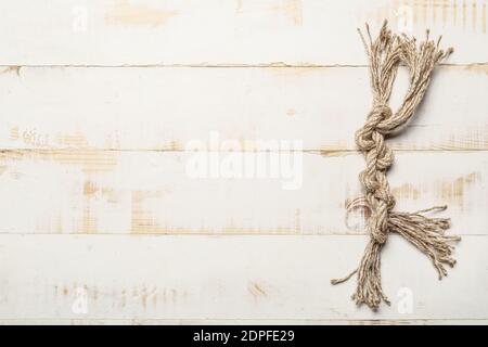 Rope with knots on light background Stock Photo