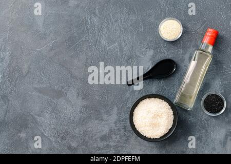 Composition with rice vinegar on dark background Stock Photo