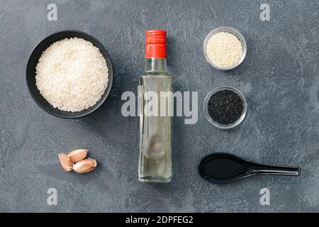 Composition with rice vinegar on dark background Stock Photo