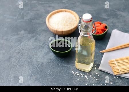 Composition with rice vinegar on dark background Stock Photo