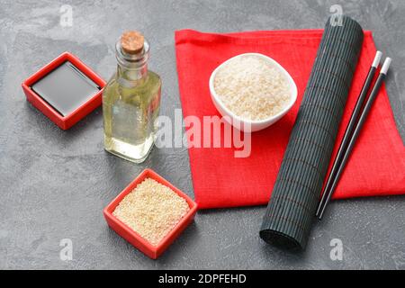 Composition with rice vinegar on dark background Stock Photo