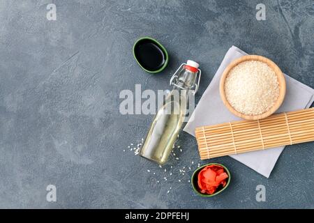 Composition with rice vinegar on dark background Stock Photo