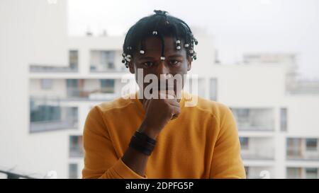 Portrait of confident black man resting head on his fist. High quality photo Stock Photo