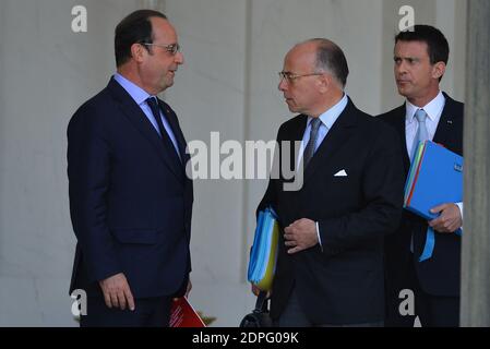 French President Francois Hollande, Prime Minister Manuel Valls and Minister of the Interior Bernard Cazeneuve pictured after the weekly cabinet meeting at the Elysee Palace in Paris, France on July 15, 2015. Photo by Christian Liewig/ABACAPRESS.COM Stock Photo