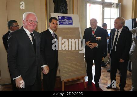 Mexican President Enrique Pena Nieto (2nd L) unveils a plaque reading Place Gilberto Bosques in honor of Mexican combatant and General Consul in France during World War II Gilberto Bosques, as (L-R) PACA region president Michel Vauzelle, Marseille mayor Jean-Claude Gaudin and French Minister of Labour, Employment, Vocational Training and Social Dialogue Francois Rebsamen look on during a reception in honor of Pena Nieto at the city hall in Marseille, southern France on July 15, 2015. President Pena Nieto is on a four-day state visit to France. Photo by Romain Beurrier/Pool/ABACAPRESS.COM Stock Photo