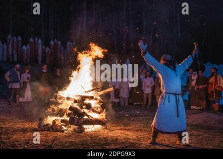 Cedynia, Poland, June 2019 Pagan reenactment of Kupala Night, called in Poland Noc Kupaly, shaman praying to old gods for their blessing. Slavic holid Stock Photo