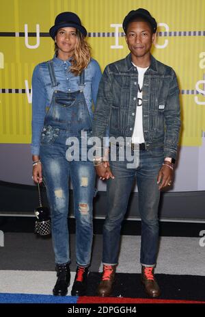 Helen Lasichanh, Pharrell Williams 199 at the 57th Annual GRAMMY Awards at  the Staples Center in Los Angeles. February 8, 2015.Helen Lasichanh, Pharrell  Williams 199 ------------- Red Carpet Event, Vertical, USA, Film