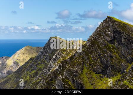 Mountains, dramatic sky and Atlantic ocean, view from mountain on Achill Island, County Mayo on the west coast in Ireland Stock Photo