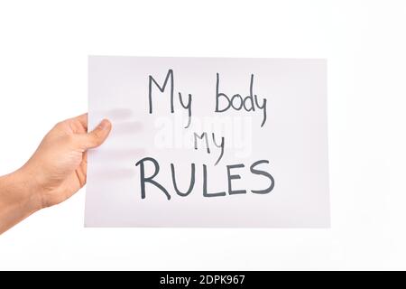 Cardboard banner with MY BODY MY RULES asking for body rights over isolated white background Stock Photo