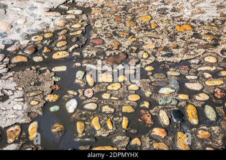 A wet section of rock and concrete street in old Puerto Vallarta, Jalisco, Mexico. Stock Photo