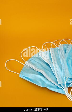 A Couple Of Masks On An Orange-yellow Background. Stock Photo