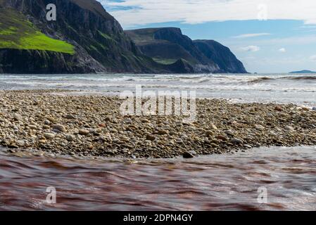 The waves, rocks and mountains, Keel Beach on Achill Island, County Mayo on the west coast of the Republic of Ireland Stock Photo