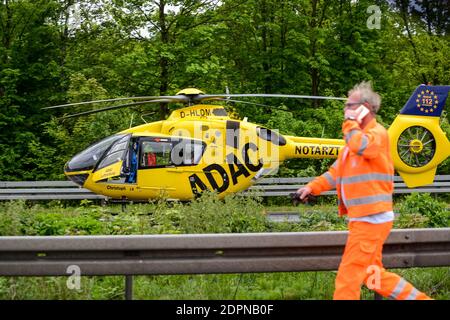 STUTTGART, GERMANY - June, 2016: A rescue helicopter on the autobahn during an accident Stock Photo