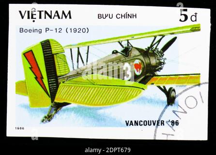 MOSCOW, RUSSIA - OCTOBER 6, 2018: A stamp printed in Vietnam shows Aircraft Boeing P-12 (1920), “EXPO'86” World fair Vancouver (Ancient aircraft) seri Stock Photo