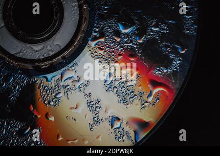 colorful Drops of water on the CD. abstract background. Soft focus Stock Photo