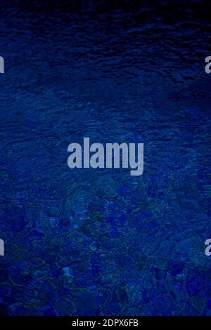 Circle water ripple wave surface background. Rain drop on swimming pool, blue background. High quality photo Stock Photo