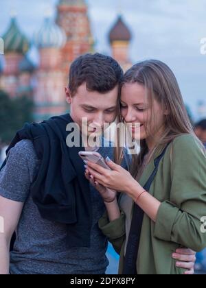 Moscow, Russia. 6th Sep, 2020. A couple takes a closer look at something on a smartphone on Red Square. Credit: Alexander Sayganov/SOPA Images/ZUMA Wire/Alamy Live News Stock Photo