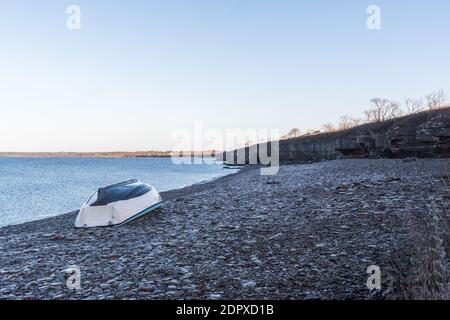 Rowboat turned upside down by a beautiful coastline on the island Öland in the Baltic Sea Stock Photo