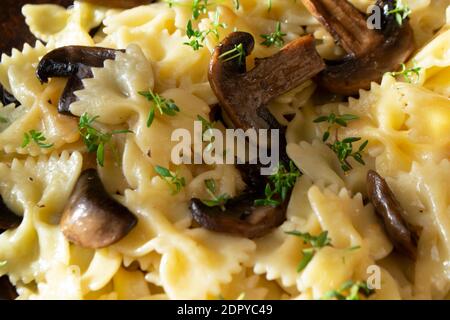 pasta with mushrooms and basil,with white wine, close up texture background