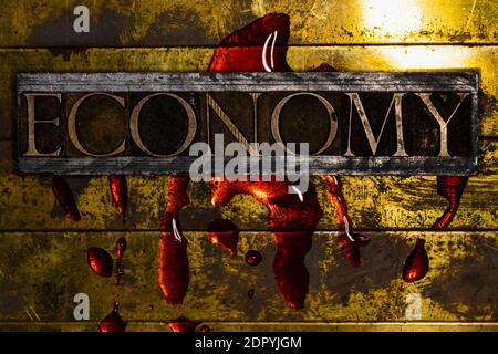 Economy text bleeding on grunge textured copper and gold background with copy space symbolizing economic collapse Stock Photo