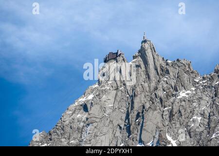 Mountain peak in clouds, mountain railway station, Aiguille du Midi, Chamonix, Haute-Savoie, France Stock Photo