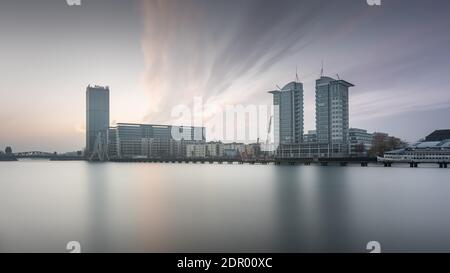 Allianz Tower and the Twin Towers on the Spree River, in front of them the Molecule Man monument by the American artist Jonathan Borofsky, Berlin Stock Photo