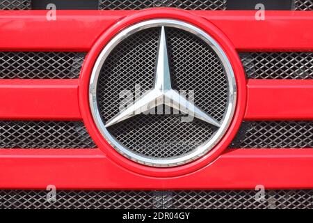 Mercedes Benz logo, Mercedes star on a red radiator grill of a truck, Germany Stock Photo