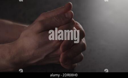 young man hands on terrazzo countertop with dim light nervous waiting , wide photo Stock Photo
