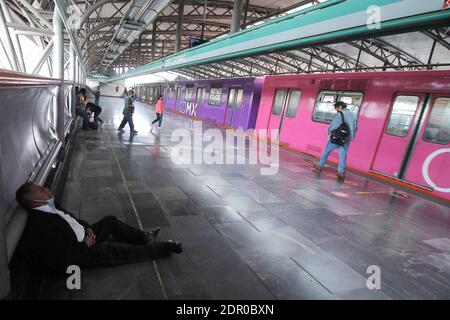 Non Exclusive: MEXICO CITY, MEXICO - DECEMBER 19: A person wears face mask while rests on the Mexican subway. People taken more drastic measures to pr Stock Photo