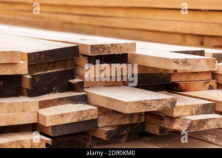 Wooden planks, lining, boards for construction works. Manufacture Stock Photo