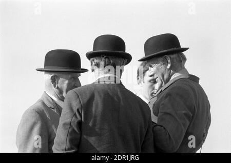 UK, England, Devonshire, Buckfastleigh, 1972. Point-to-Point horse races were held at  Dean Court on the Dean Marshes, close to the A38 between Plymouth and Exeter. Three stewards wearing black bowler hats. Stock Photo