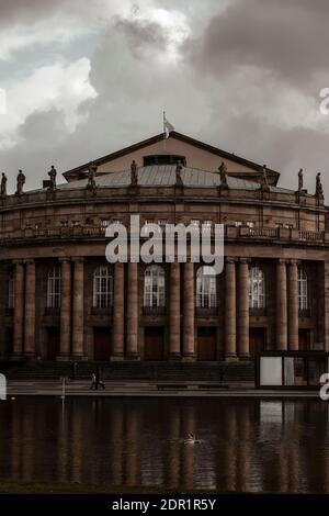 March 07, 2020 Stuttgart, Germany - Front view of famous historic Stuttgart Opera house designed by architect Max Littmann with small  lake Eckensee