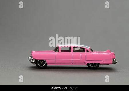 Ukraine, Kyiv - February 28. 2020: Hot wheels toy car close up picture on gray background. Hot Wheels is a scale die-cast toy cars by American toy mak Stock Photo