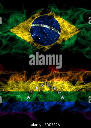 Brazil, Brazilian vs Venezuela, gay smoky mystic flags placed side by side. Thick colored silky abstract smoke flags. Stock Photo