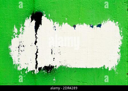Abstract graffiti on a damaged wall. Color paint on the wall. Stock Photo