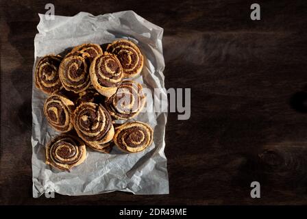 Chocolate homemade cookies on a wooden background. Rustic style. Homemade simple food. Place for text. Bun top view. Copy space. Stock Photo