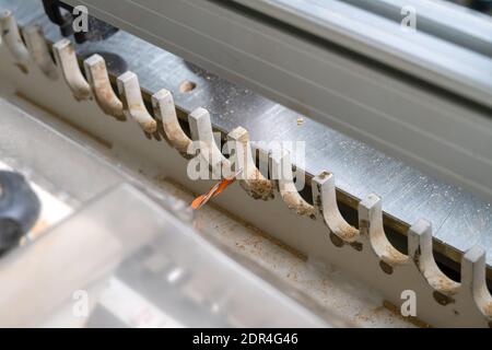 Close-up of the drill bit in the drill-filler machine at the time of work preparation. Woodworking machine in a carpenter's workshop Stock Photo