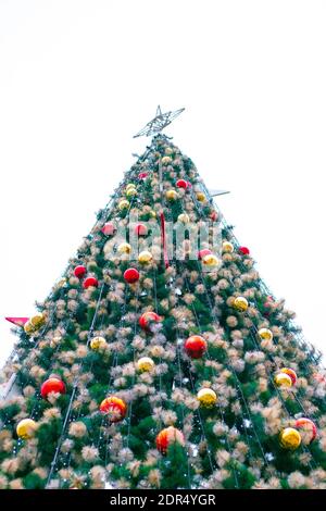Artificial Christmas tree with garlands and balls Stock Photo - Alamy