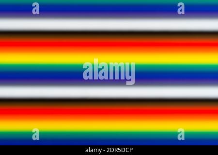 Blurred defocused multi colored lines background texture. Abstract dynamic multicolored modern background with bokeh rainbow lights Stock Photo