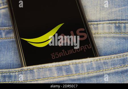 Viersen, Germany - May 9. 2020: Close up of smartphone screen in blue jeans pocket with logo lettering of thai mobile phone provider AIS (selective fo Stock Photo