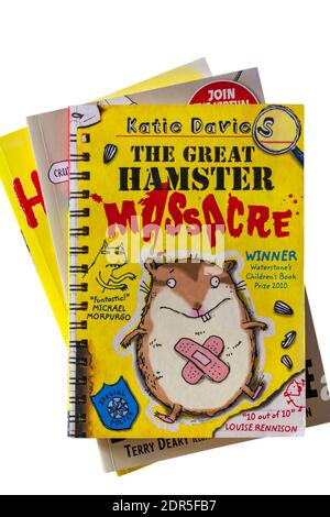 Pile of books with The Great Hamster Massacre book by Katie Davies on top set on white background Stock Photo