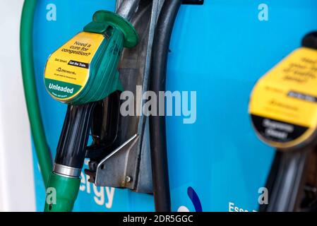 Petrol and diesel pump handles on forecourt. Stock Photo