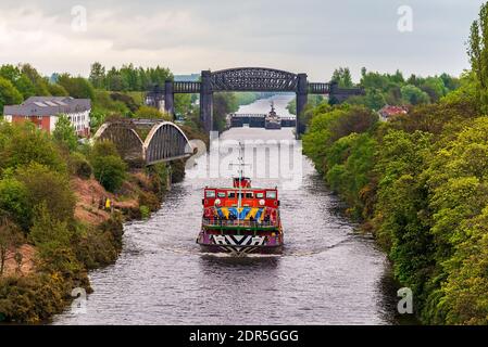 Merseyferries Dazzle ferry Snowdrop on the Manchester Ship Canal cruise. Seen passing under the Warrington cantilever bridge in Warrington. Stock Photo