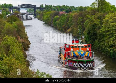 Merseyferries Dazzle ferry Snowdrop on the Manchester Ship Canal cruise. Seen passing under the Warrington cantilever bridge in Warrington.