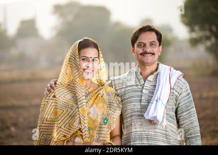 Rural Indian couple in agricultural field Stock Photo - Alamy