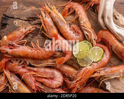 Close-up of giang raw shrimps, prawns on a wooden board Stock Photo